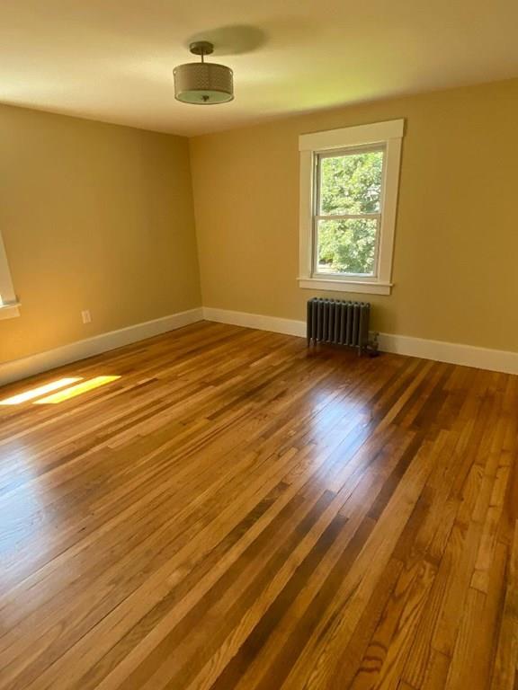 64 Chilson Street Springfield, MA 01118 - Photo 21 of 36 an empty room with wooden floor and windows