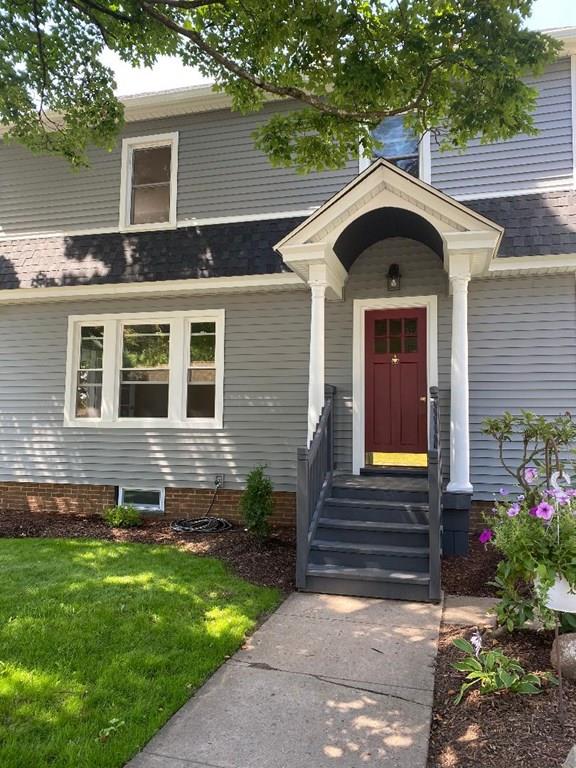 64 Chilson Street Springfield, MA 01118 - Photo 3 of 36 a front view of a house with garden