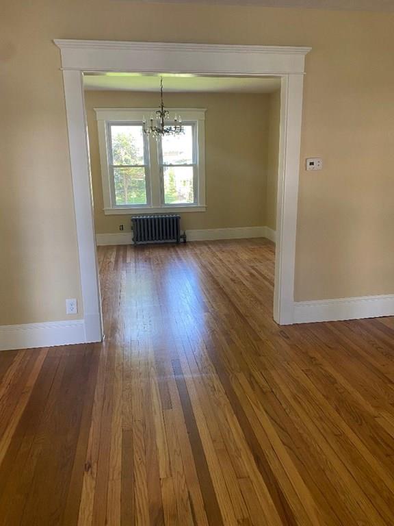 64 Chilson Street Springfield, MA 01118 - Photo 5 of 36 an empty room with wooden floor and windows