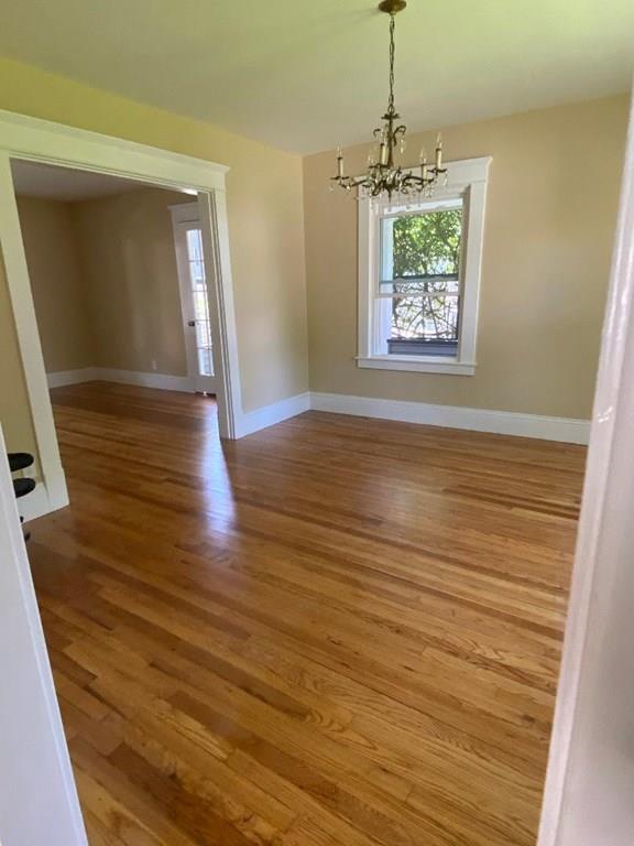 64 Chilson Street Springfield, MA 01118 - Photo 7 of 36 a view of a room with wooden floor chandelier and a window