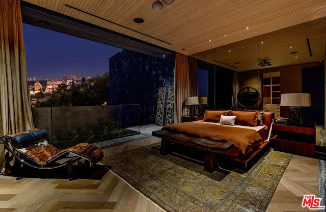 a front view of a house with outdoor seating