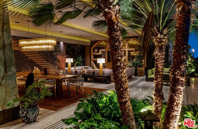 a living room with furniture a lamp and a fireplace