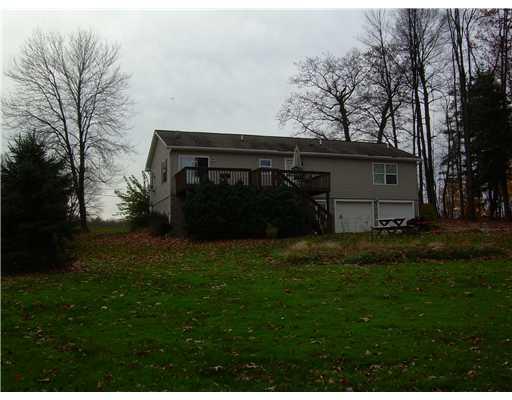 135 Shields Road Forestville, PA 16035 - Photo 3 of 18 Exterior Back. Great Deck to Enjoy the Beauty of the Seasons....2 Car Integral Garage