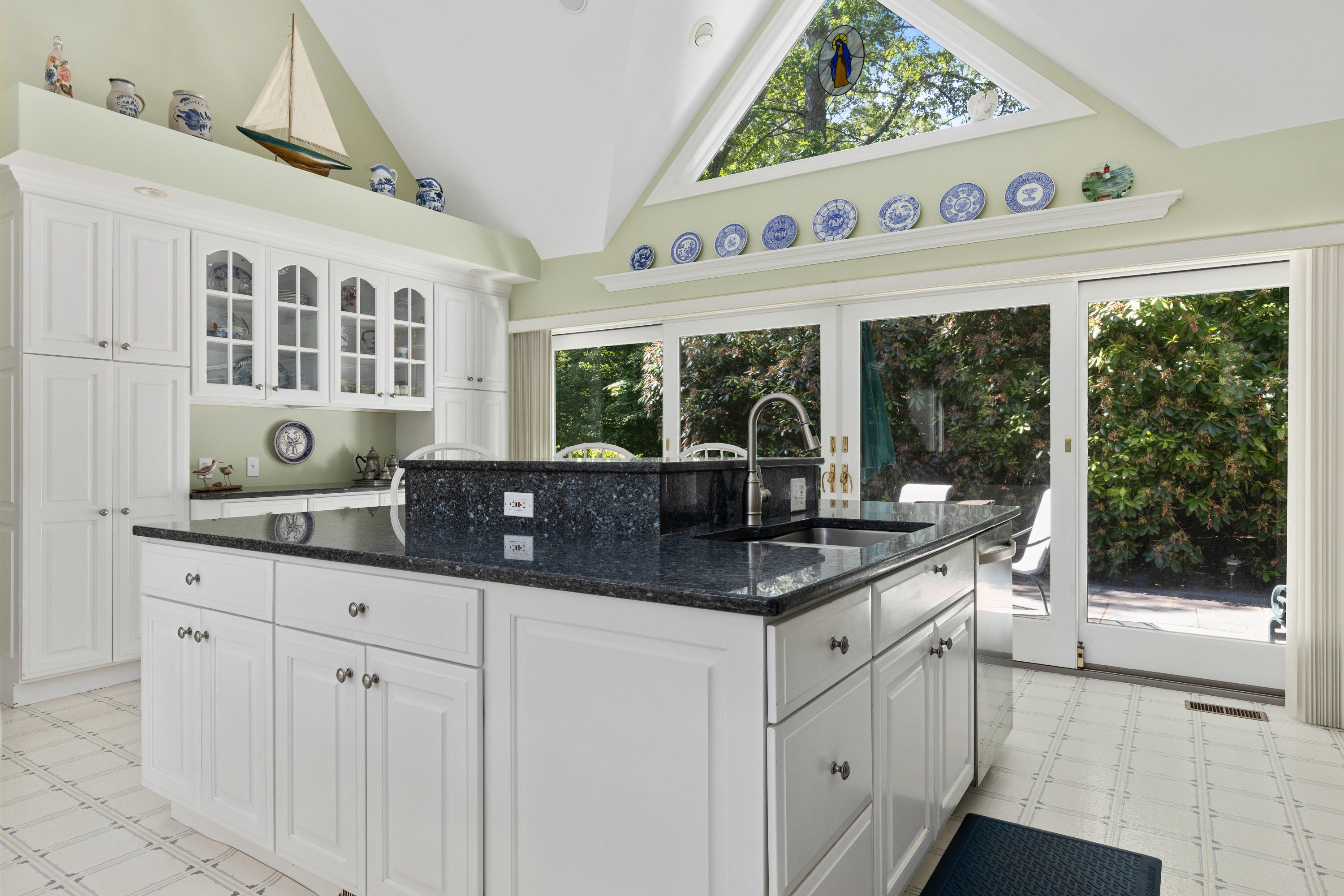 316 Wheeler Road Marstons Mills, MA 02648 - Photo 17 of 50 a kitchen with stainless steel appliances granite countertop a stove and a sink