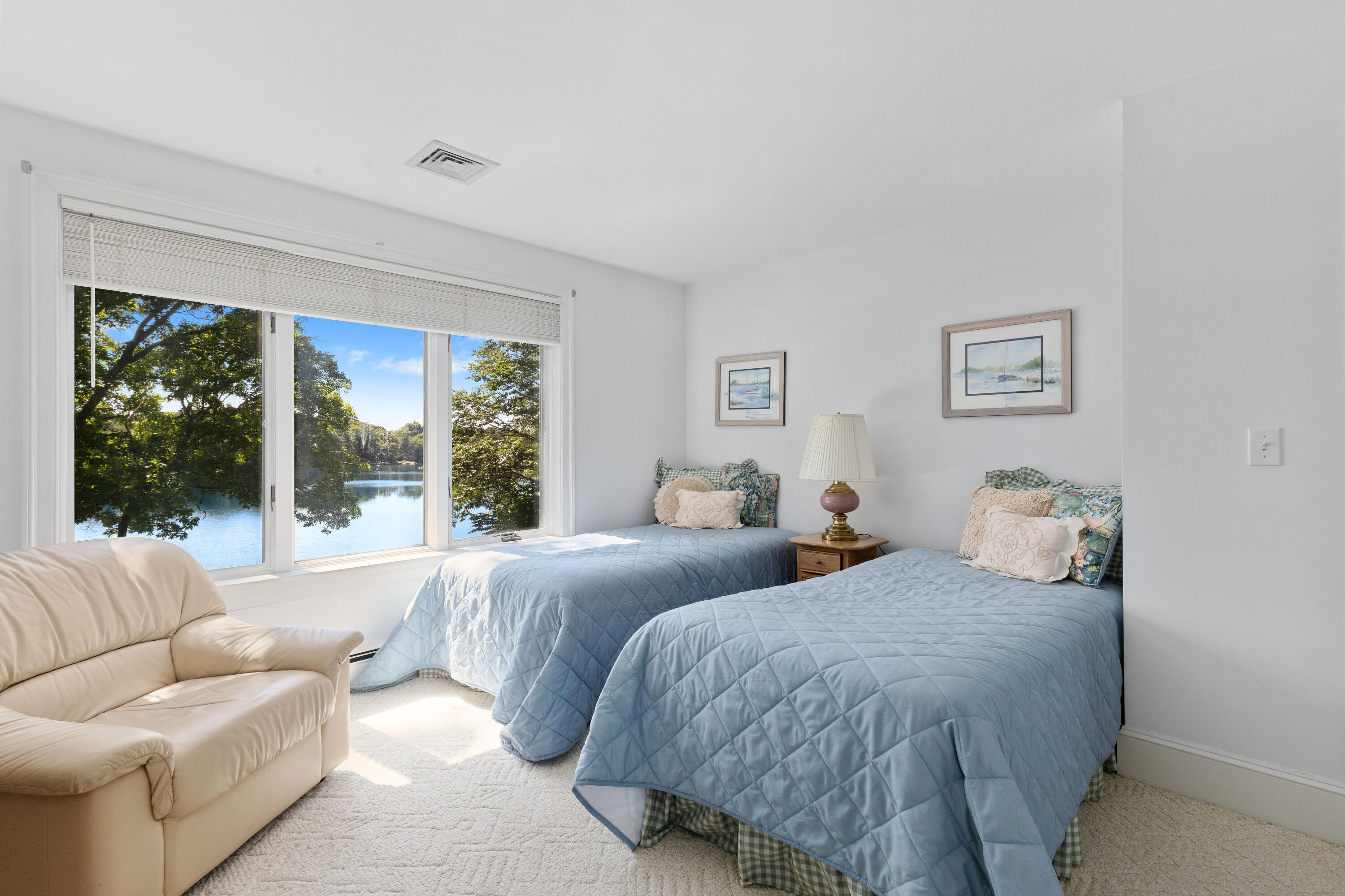 316 Wheeler Road Marstons Mills, MA 02648 - Photo 22 of 50 a bedroom with a large bed and a large window