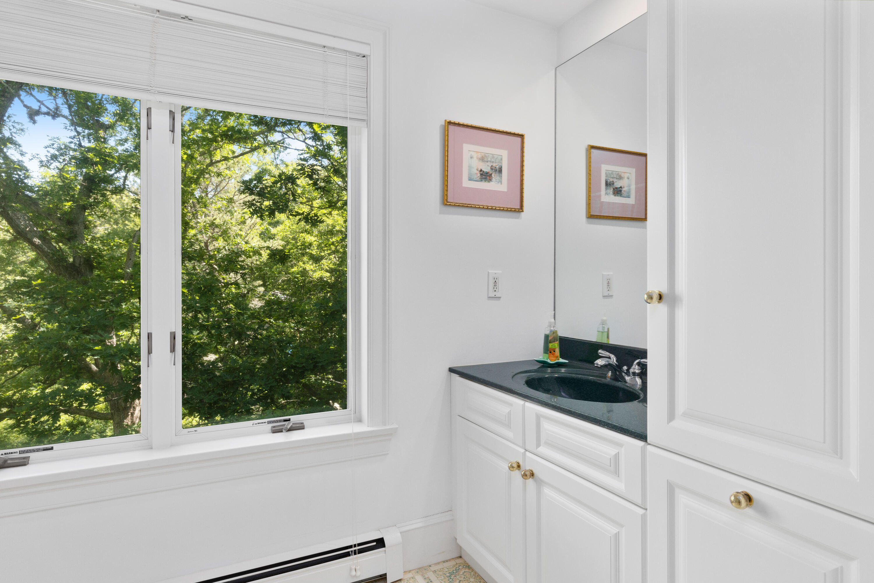 316 Wheeler Road Marstons Mills, MA 02648 - Photo 24 of 50 a kitchen with a window and a stove