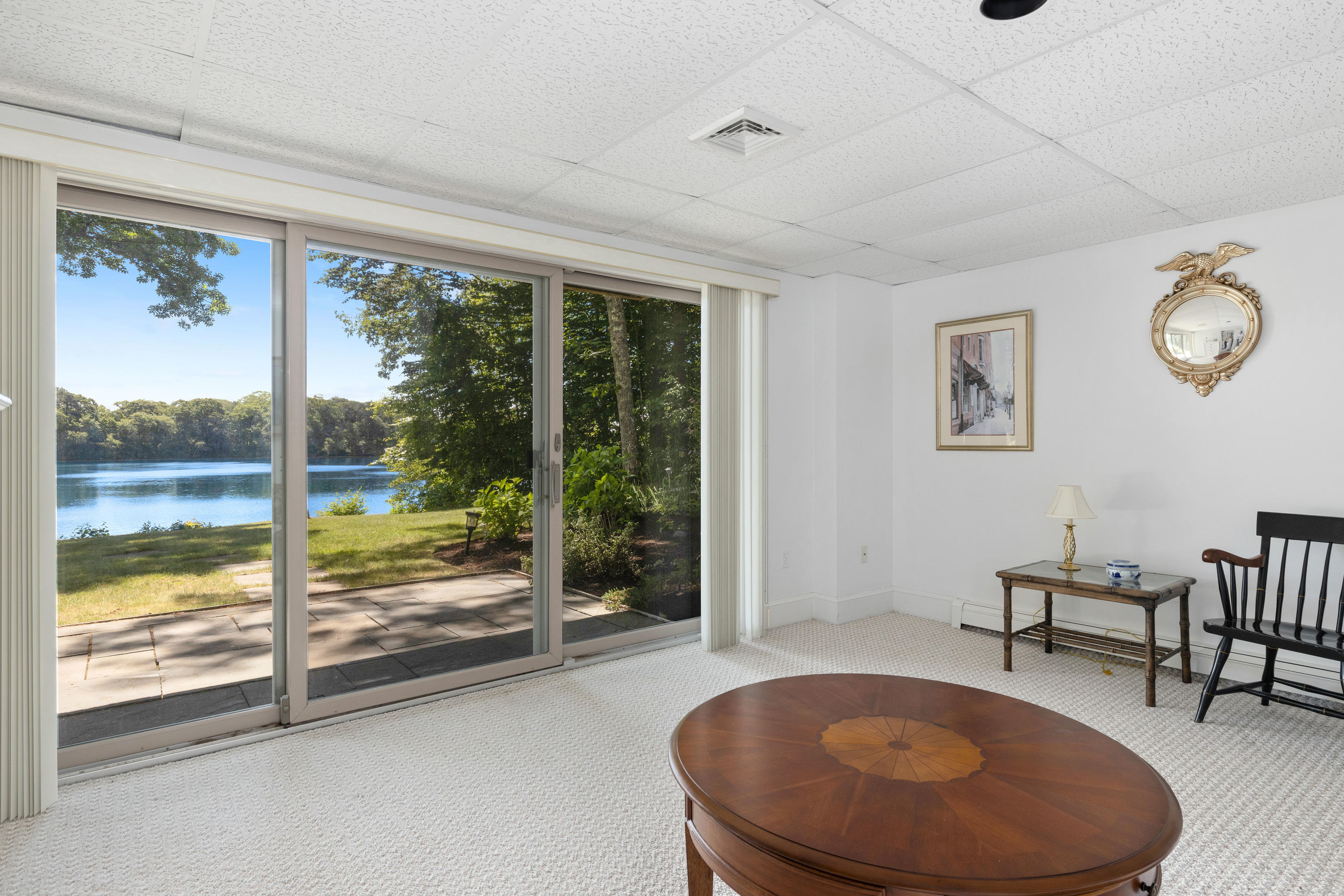 316 Wheeler Road Marstons Mills, MA 02648 - Photo 27 of 50 a view of a livingroom with furniture wooden floor and a rug