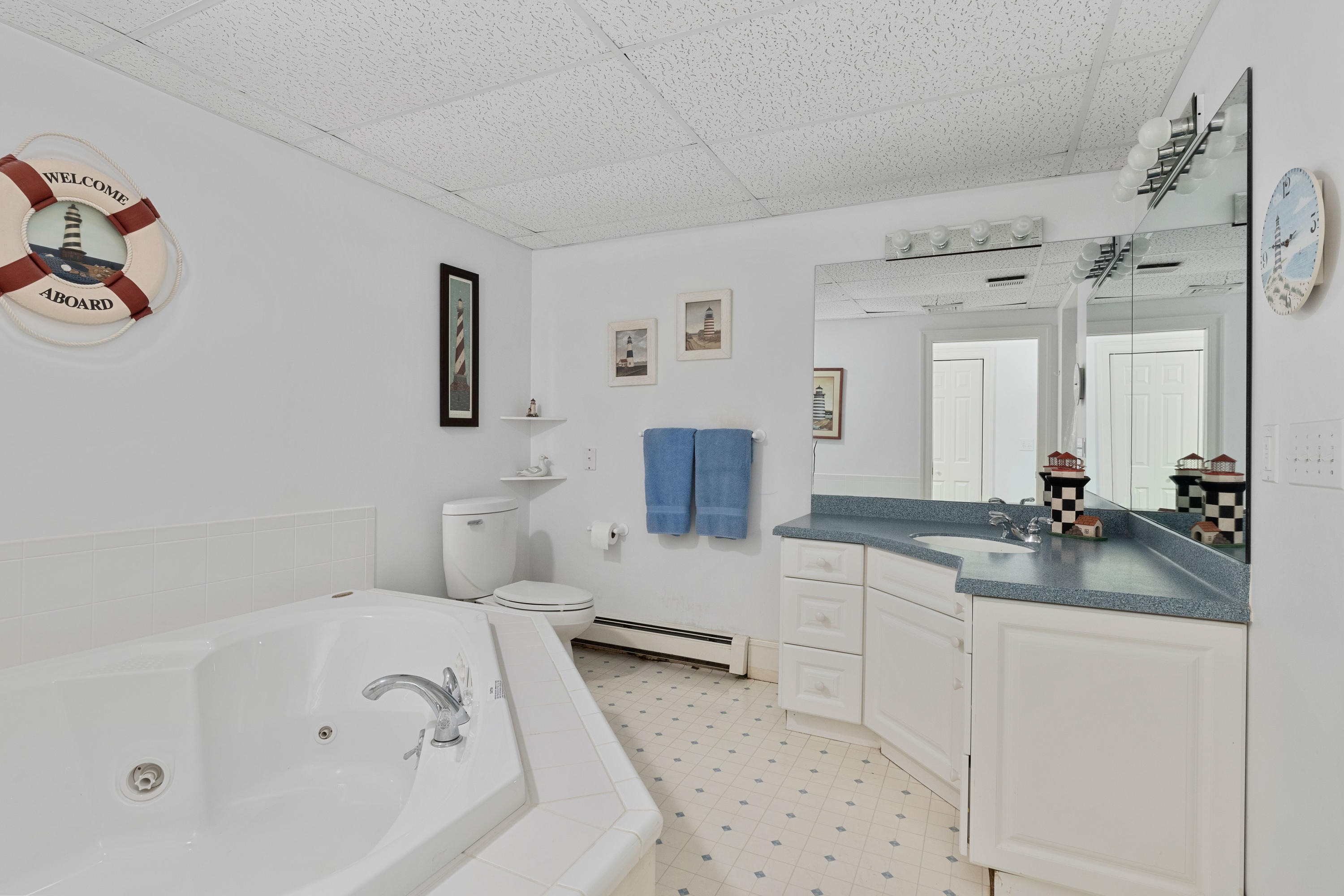 316 Wheeler Road Marstons Mills, MA 02648 - Photo 31 of 50 a bathroom with a tub sink and mirror