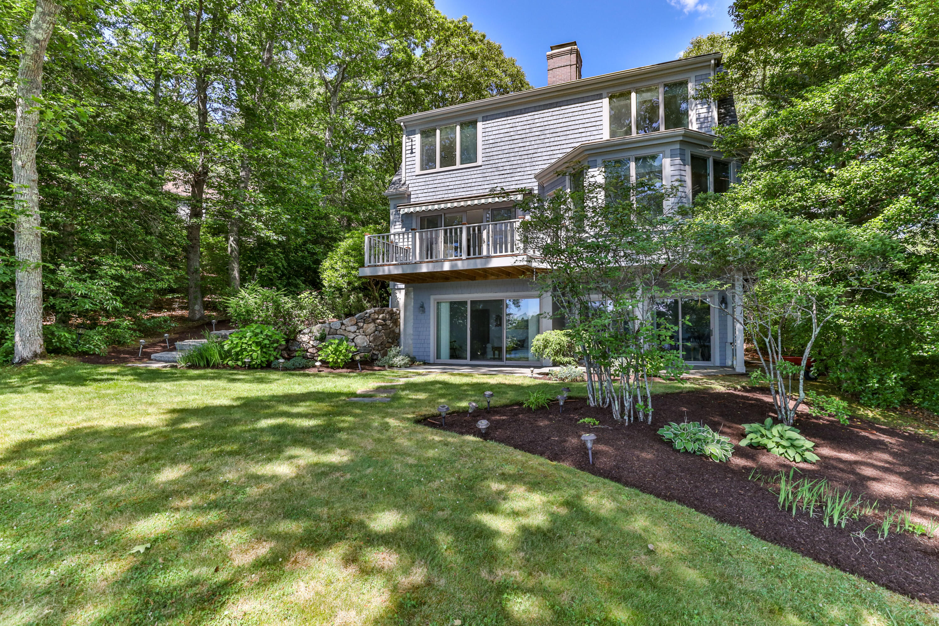 316 Wheeler Road Marstons Mills, MA 02648 - Photo 35 of 50 a front view of a house with garden