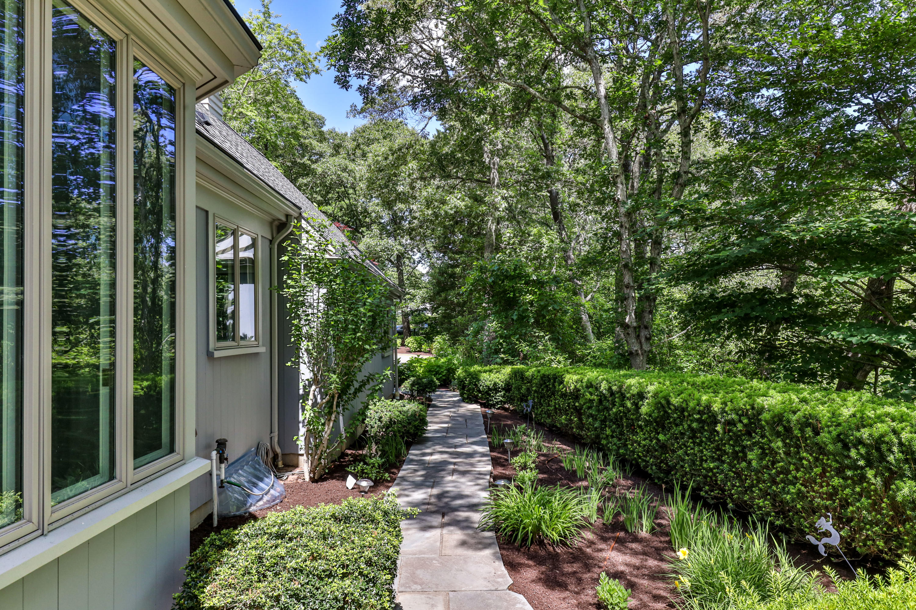 316 Wheeler Road Marstons Mills, MA 02648 - Photo 38 of 50 a porch with seating space