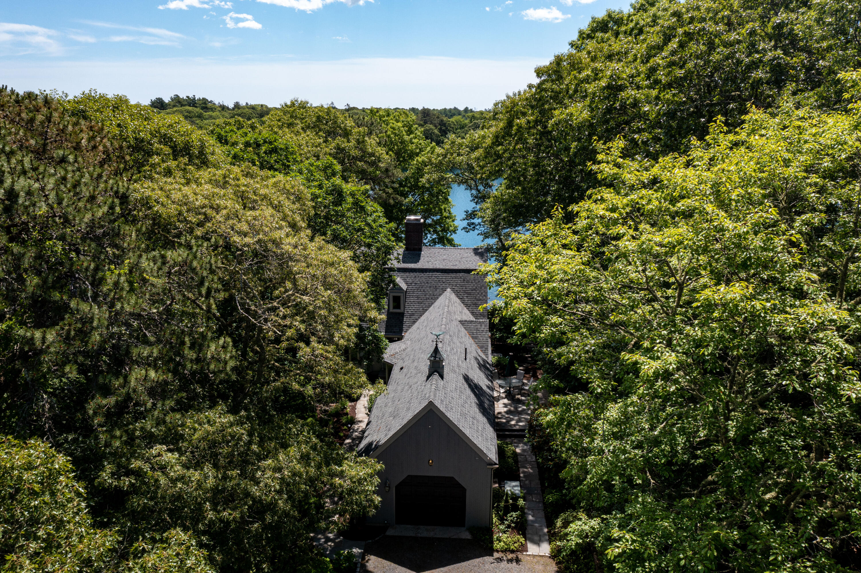 316 Wheeler Road Marstons Mills, MA 02648 - Photo 39 of 50 a aerial view of a house with a yard and large trees