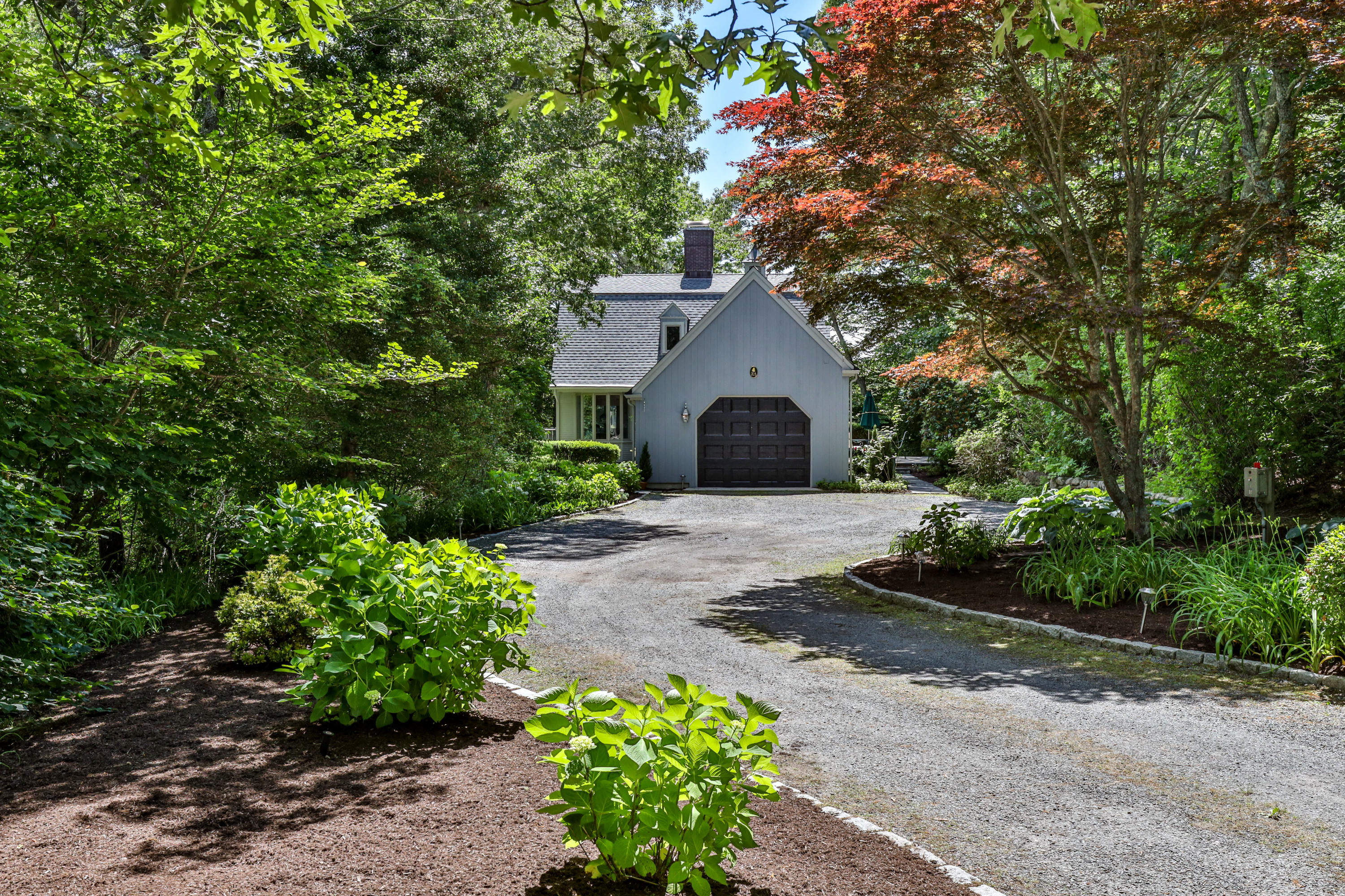 316 Wheeler Road Marstons Mills, MA 02648 - Photo 4 of 50 a front view of a house with a yard