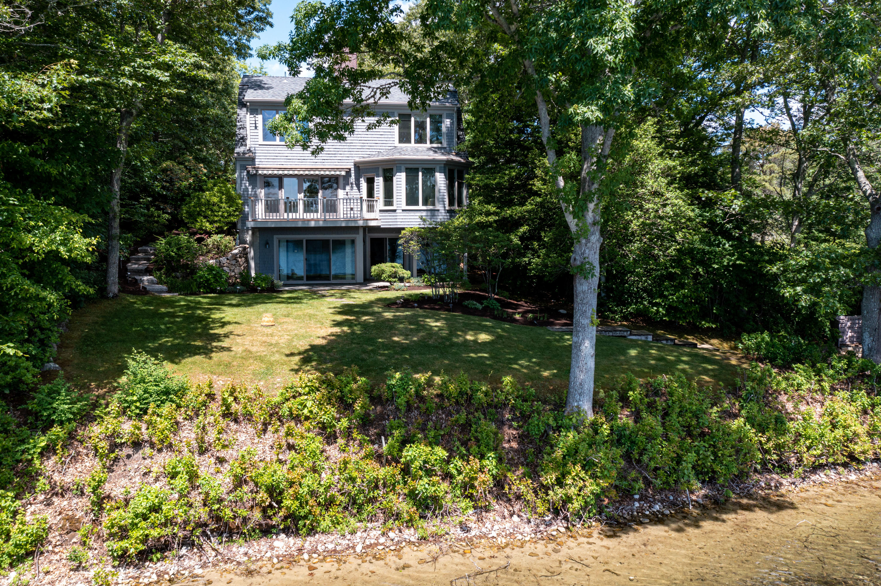 316 Wheeler Road Marstons Mills, MA 02648 - Photo 43 of 50 a view of a house with a yard