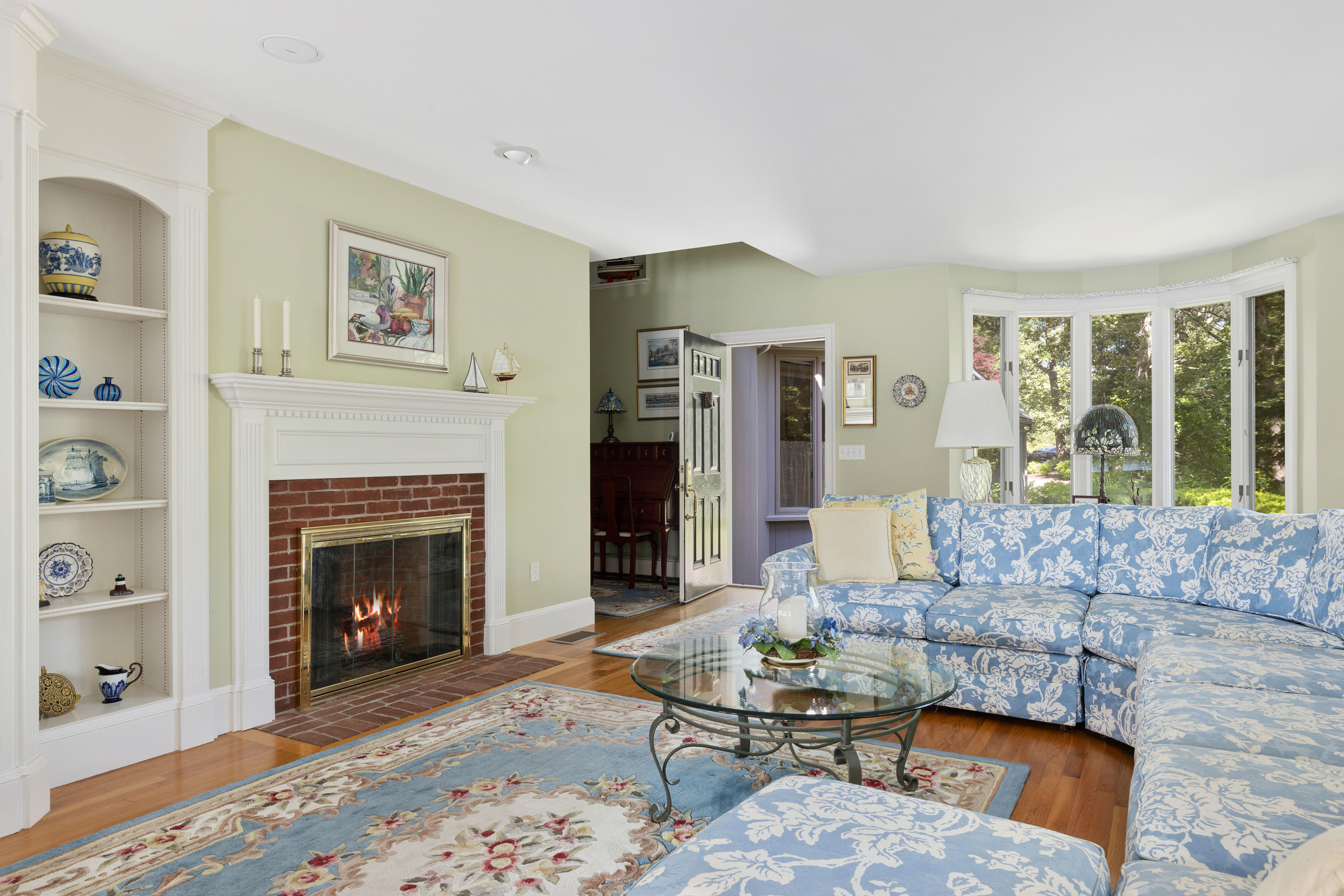 316 Wheeler Road Marstons Mills, MA 02648 - Photo 10 of 50 a living room with furniture large window and a fireplace