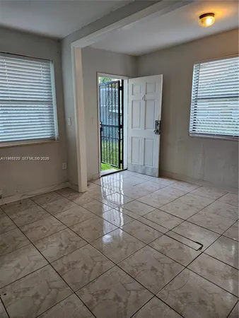 a view of a room that has a sink and a window