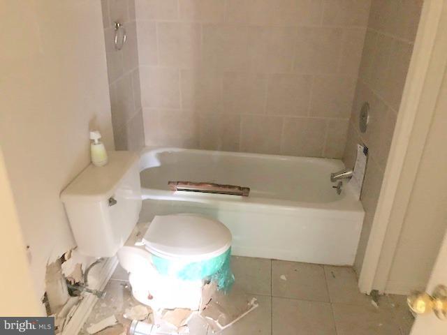 8324 Bock Road Fort Washington, MD 20744 - Photo 8 of 11 a white toilet sitting next to a bath tub
