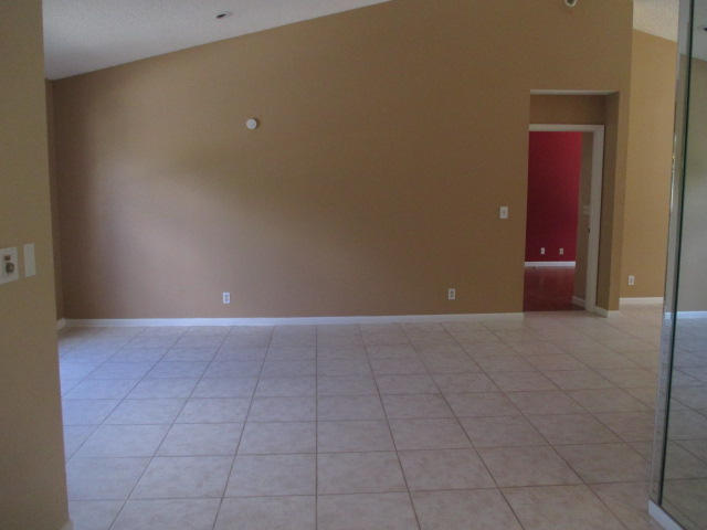 12084 Rockwell Way Boca Raton, FL 33428 - Photo 3 of 25 a view of an empty room with a bathroom
