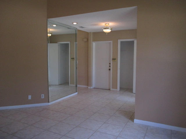12084 Rockwell Way Boca Raton, FL 33428 - Photo 4 of 25 a view of an empty room with closet and bathroom