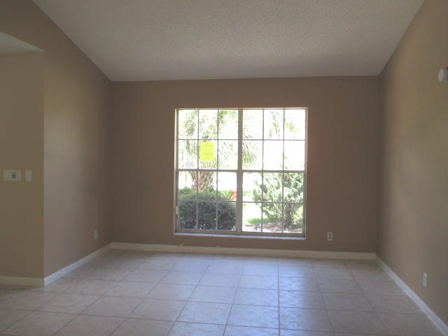 12084 Rockwell Way Boca Raton, FL 33428 - Photo 5 of 25 an empty room with a window
