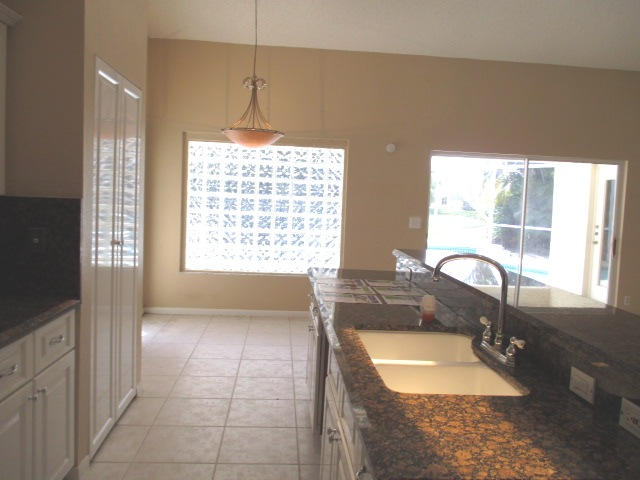 12084 Rockwell Way Boca Raton, FL 33428 - Photo 8 of 25 a bathroom with a tub sink and window