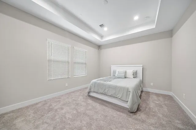 a room with a bed and a window