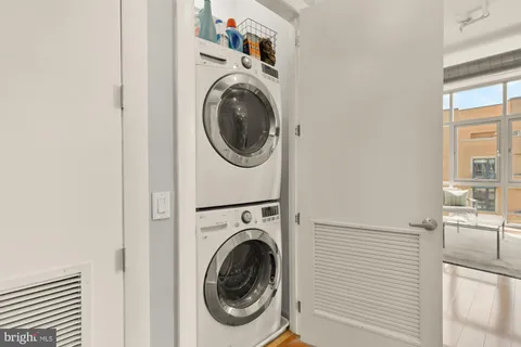 a view of a hallway with washer and dryer