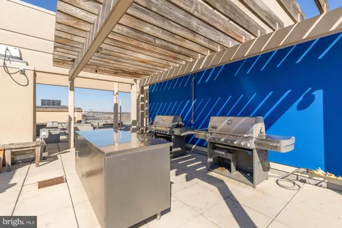 a view of a kitchen with kitchen island dining table and chairs