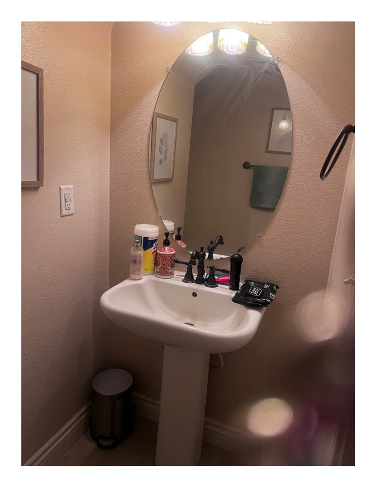 8692 East 9th Street, Unit 29 Rancho Cucamonga, CA 91730 - Photo 13 of 15 a bathroom with a sink mirror and toilet