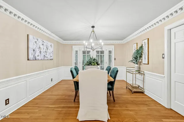 a kitchen with stainless steel appliances granite countertop a refrigerator a stove and a sink