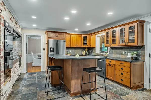a view of a livingroom with workspace and a window