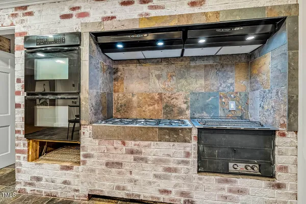 a bathroom with a sink a mirror and a shower