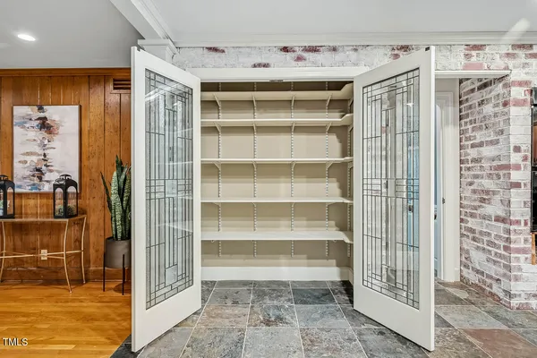 a spacious bathroom with a sink double vanity and a mirror