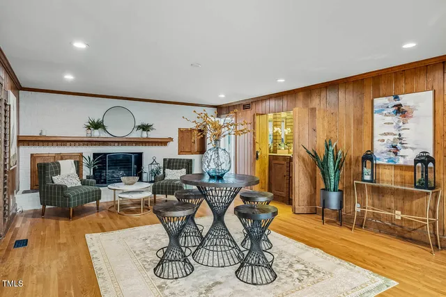 a view of empty room with window and ceiling fan
