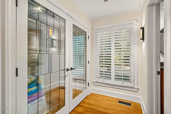 an aerial view of a house with a big yard