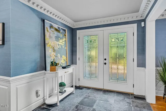a view of a dining room with furniture and window