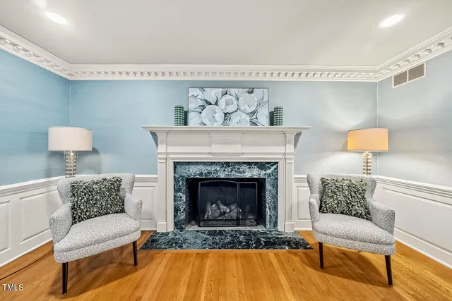 a view of a livingroom with workspace and a window