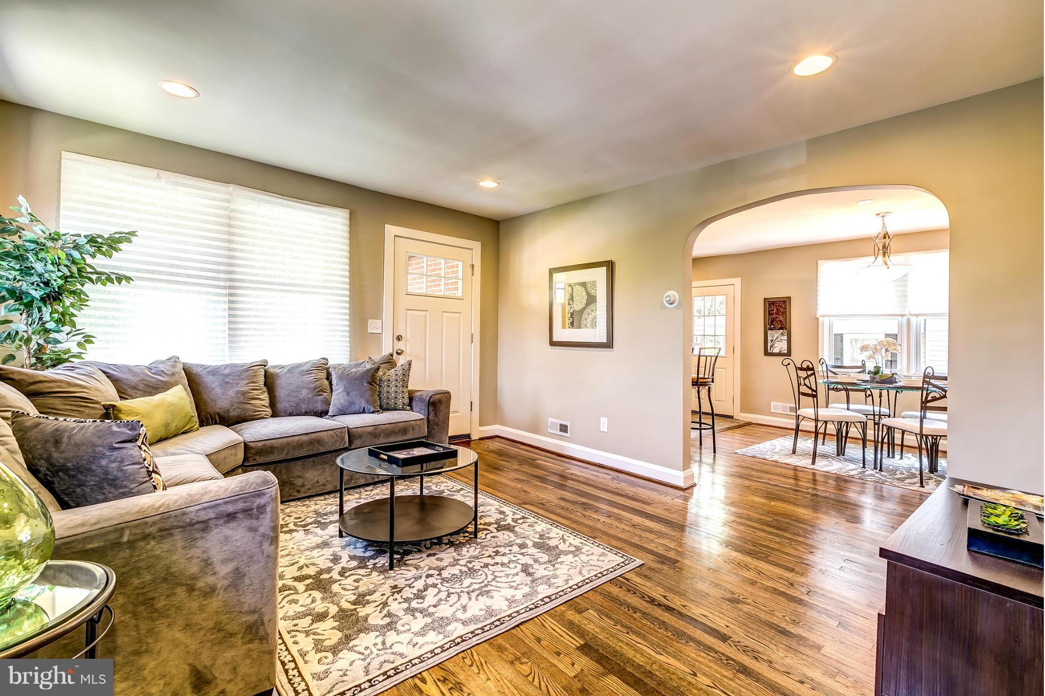 8304 Oakleigh Road Baltimore, MD 21234 - Photo 1 of 30 a living room with furniture and wooden floor