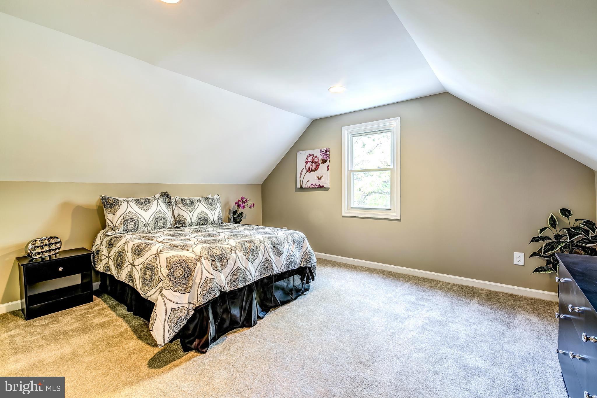 8304 Oakleigh Road Baltimore, MD 21234 - Photo 12 of 30 a bedroom with a bed and window