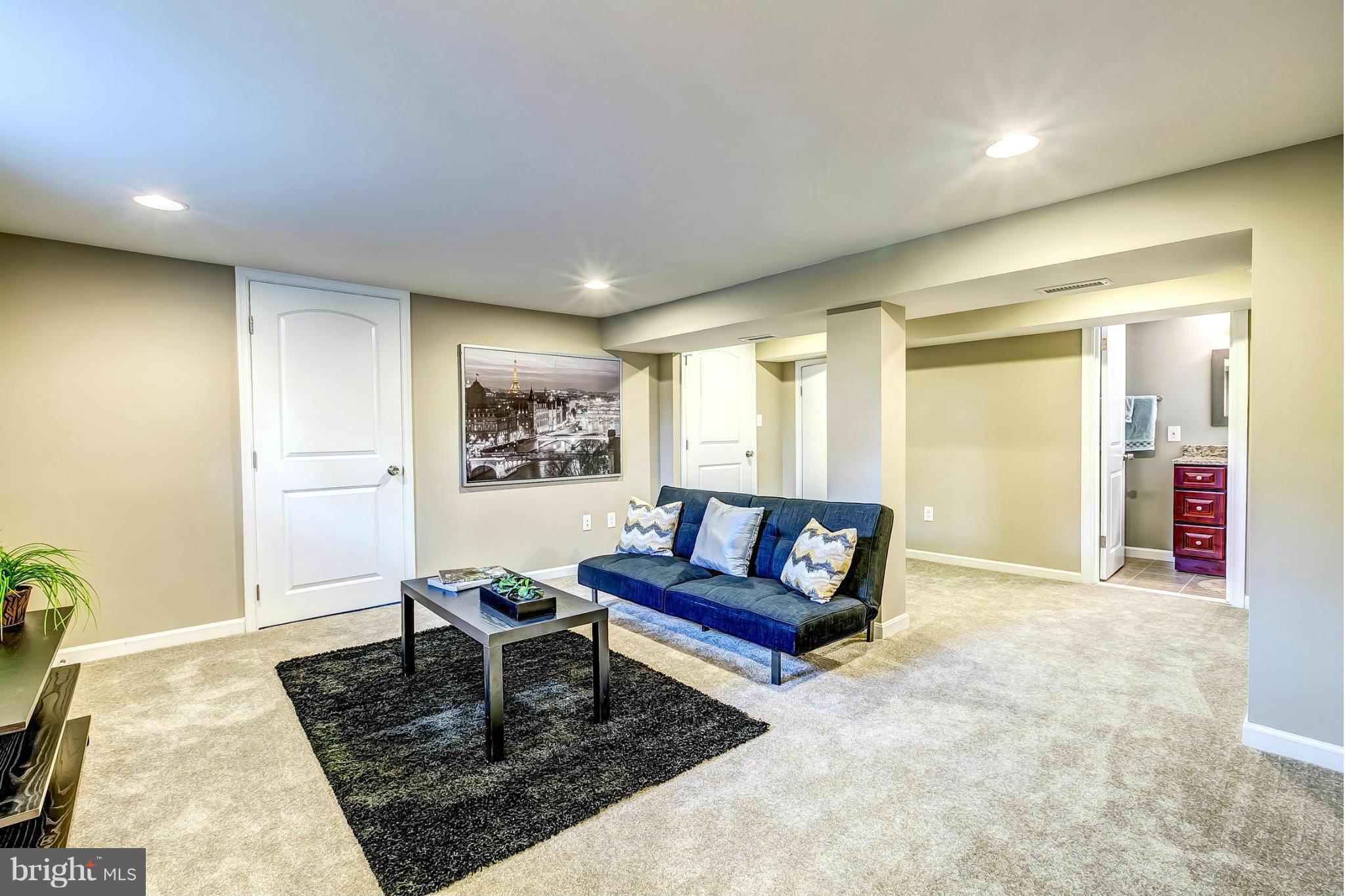 8304 Oakleigh Road Baltimore, MD 21234 - Photo 22 of 30 a living room with furniture and a rug