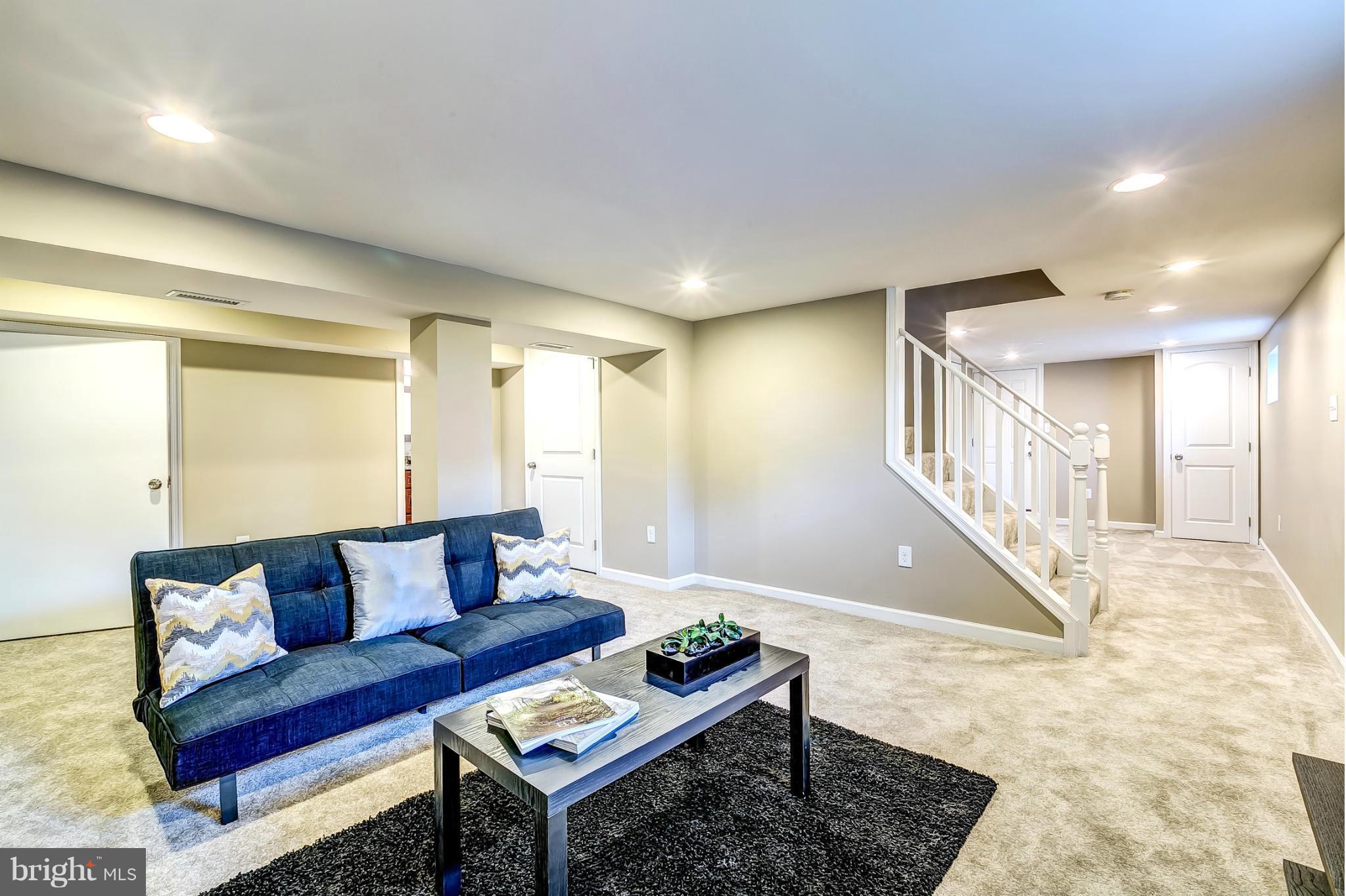 8304 Oakleigh Road Baltimore, MD 21234 - Photo 23 of 30 a living room with furniture and a rug
