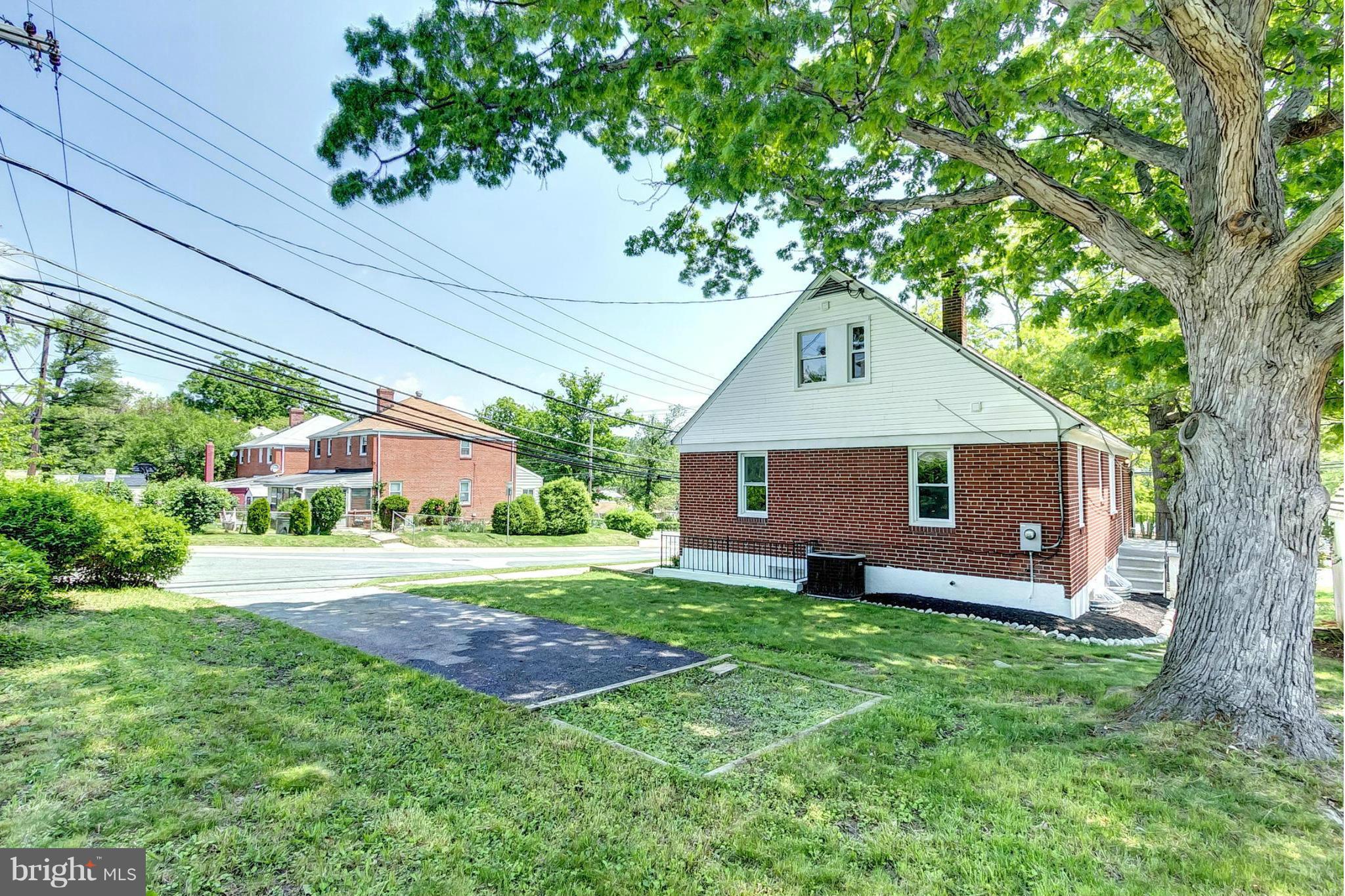 8304 Oakleigh Road Baltimore, MD 21234 - Photo 29 of 30 a front view of a house with a garden