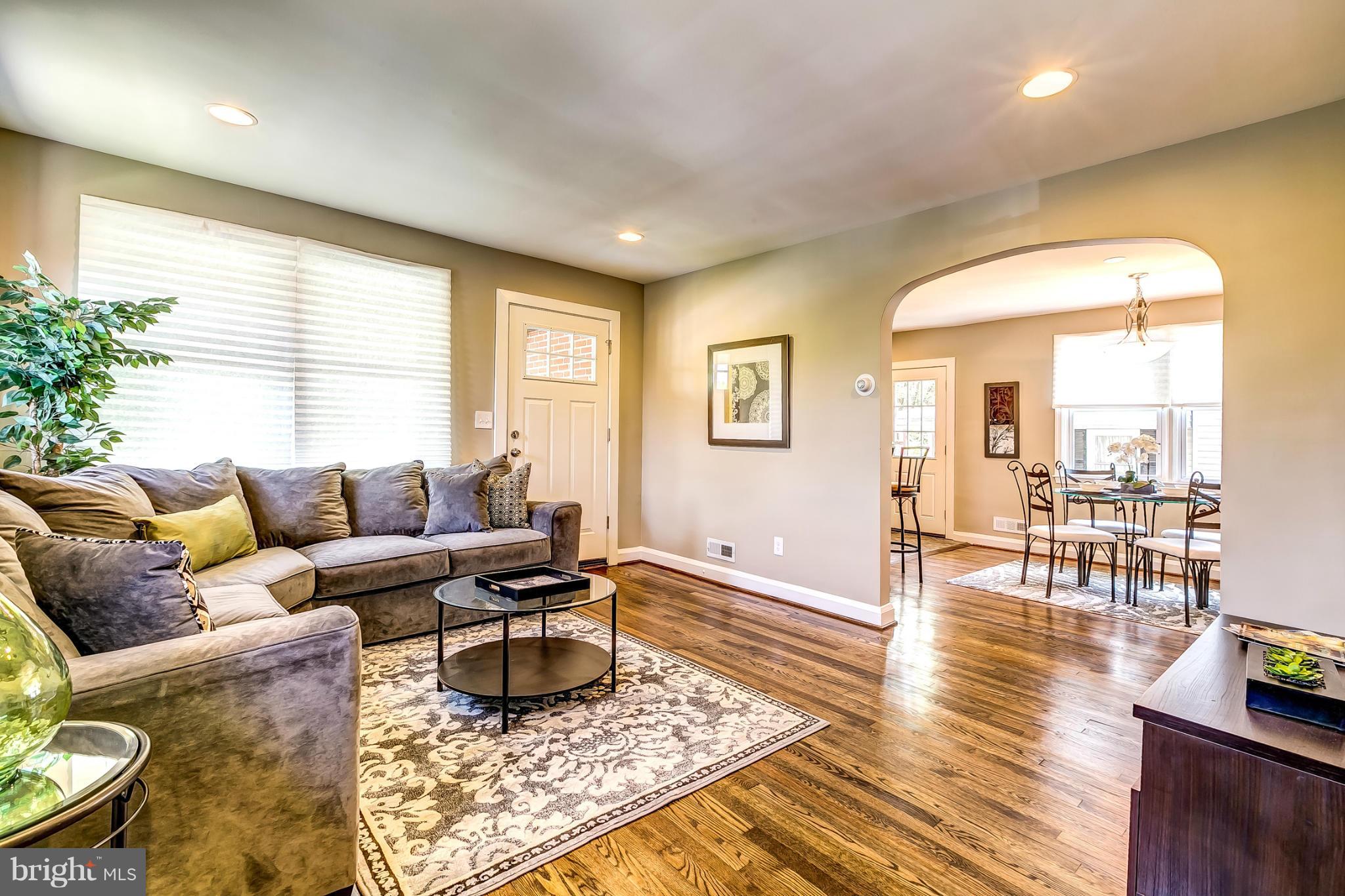 8304 Oakleigh Road Baltimore, MD 21234 - Photo 5 of 30 a living room with furniture and wooden floor