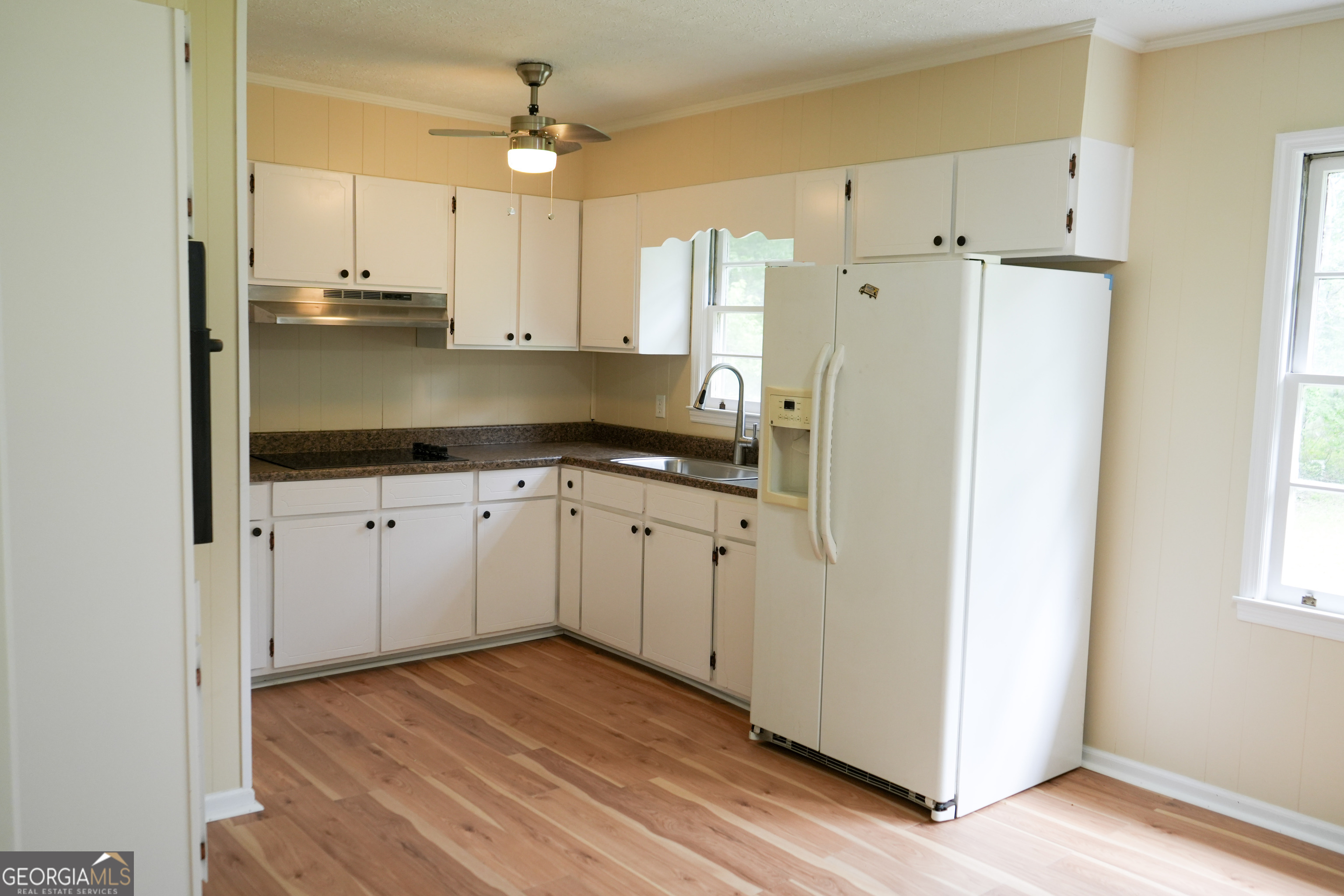 1869 Minter Blue Springs Road Rockledge, GA 30454 - Photo 22 of 45 a kitchen with stainless steel appliances a refrigerator sink and cabinets