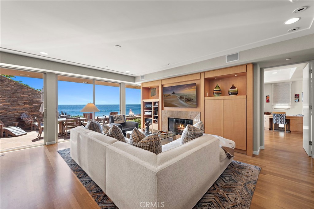1603-1613 South Coast Highway, Unit F Laguna Beach, CA 92651 - Photo 6 of 34 a living room with furniture fireplace and a large window