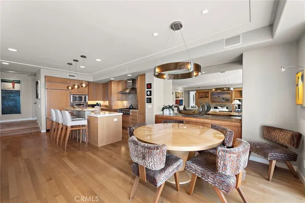 a living room with fireplace furniture and a large window