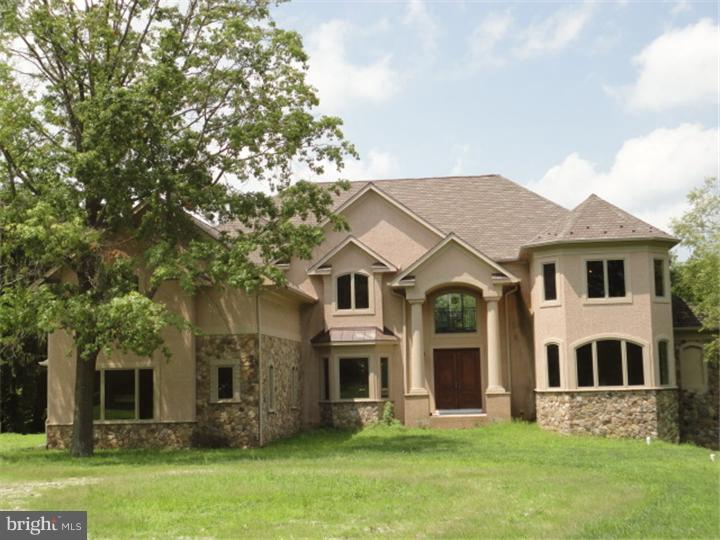 851 Cox Road Moorestown, NJ 08057 - Photo 1 of 9 a front view of a house with a garden