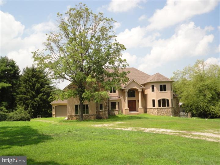 851 Cox Road Moorestown, NJ 08057 - Photo 2 of 9 a front view of a house with a garden