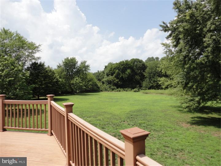 851 Cox Road Moorestown, NJ 08057 - Photo 6 of 9 a view of a deck and yard with green space