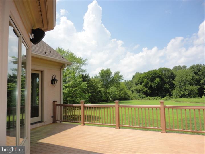 851 Cox Road Moorestown, NJ 08057 - Photo 7 of 9 a balcony with wooden floor next to a yard