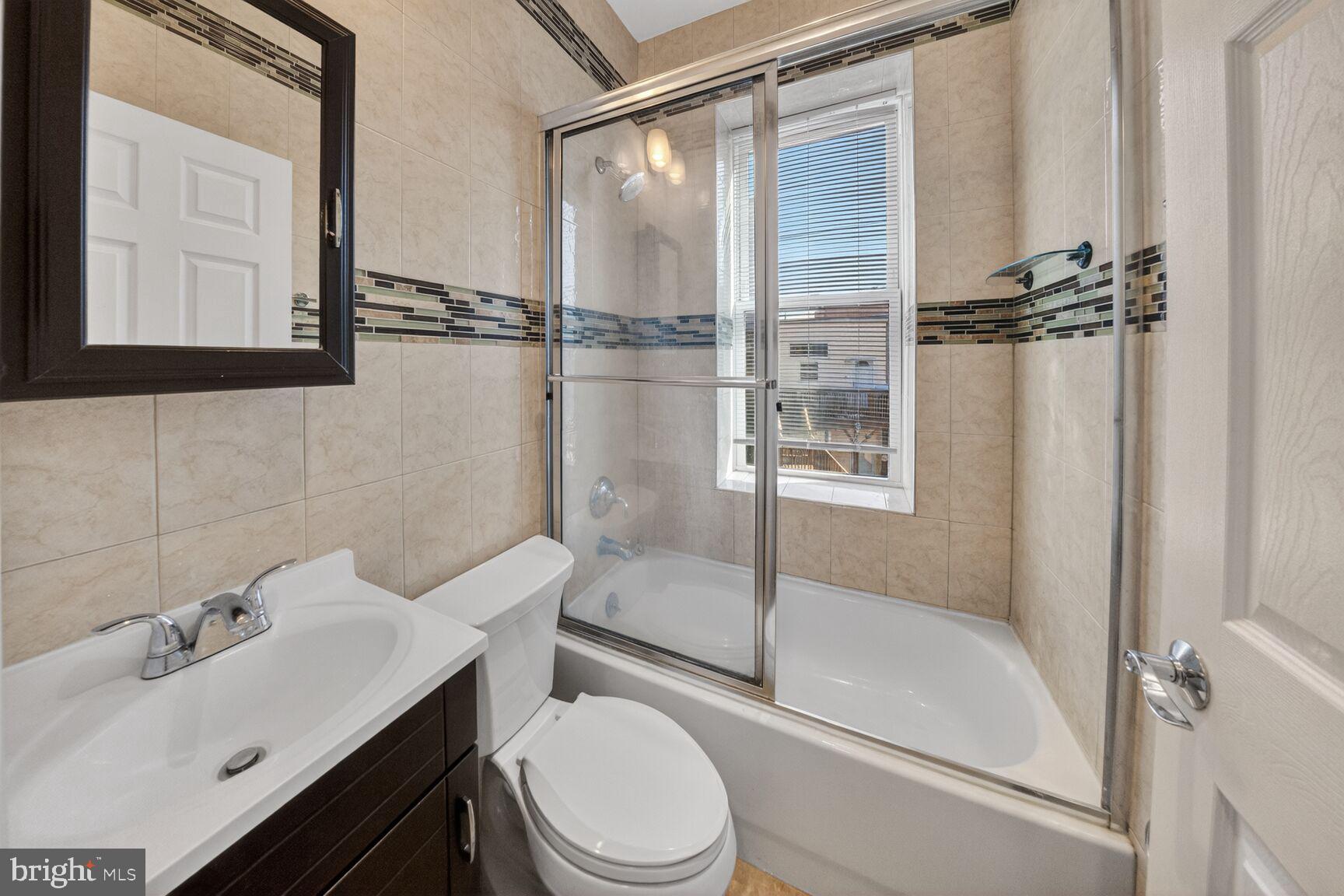 424 Q Street Northwest, Unit H Washington, DC 20001 - Photo 14 of 16 a bathroom with a sink toilet and shower